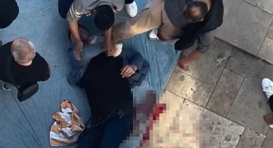 Silahla vurduğu yaralıya yerde yatarken tekme attı